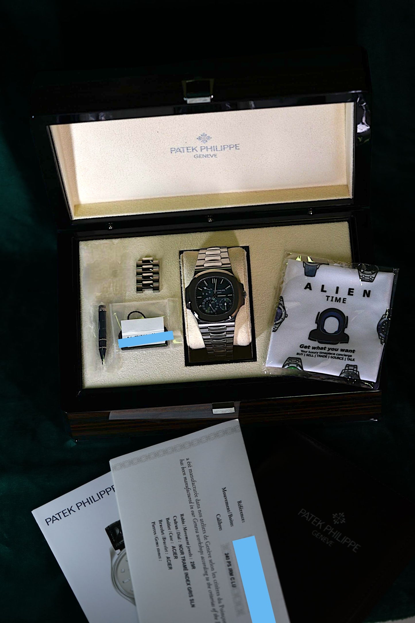 Patek Philippe Nautilus Stainless Steel 5712/1A-001 Discontinued a RARE Moonphase & Date Blue Dial watch in Full Set