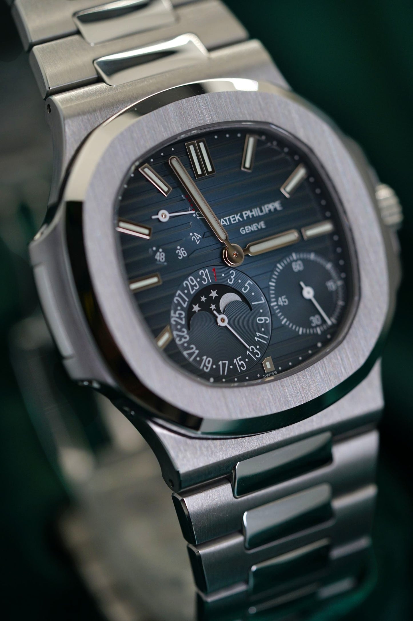 Patek Philippe Nautilus Stainless Steel 5712/1A-001 Discontinued a RARE Moonphase & Date Blue Dial watch in Full Set