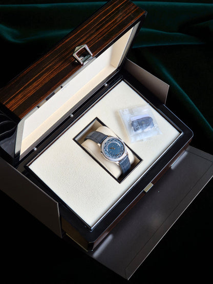 Patek Philippe World Time, Ref. 7130g | a Rare White Gold and Diamond-set Ladies' World Time Wristwatch