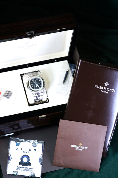 NEW PATEK PHILIPPE NAUTILUS 5990/1A-011 | STEEL TRAVEL TIME CHRONOGRAPH | SUNBURST BLUE DIAL | Q4 2025 COMPLETE SET