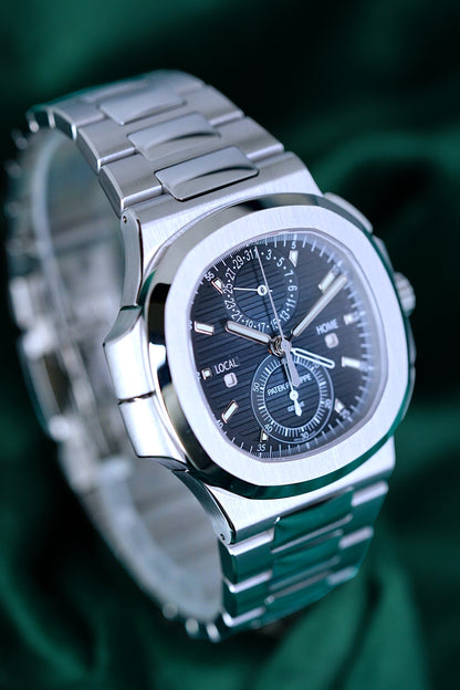Patek Philippe Nautilus | Ref 5990/1a-011 | A Blue Dial Steel Travel Time Chronograph Complication Wristwatch