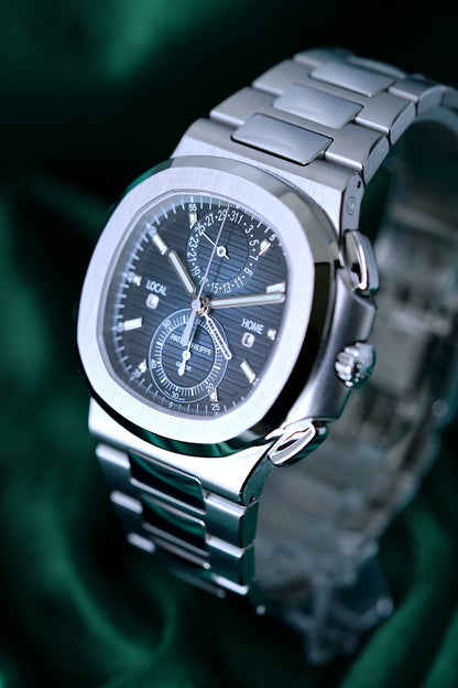 Patek Philippe Nautilus | Ref 5990/1a-011 | A Blue Dial Steel Travel Time Chronograph Complication Wristwatch