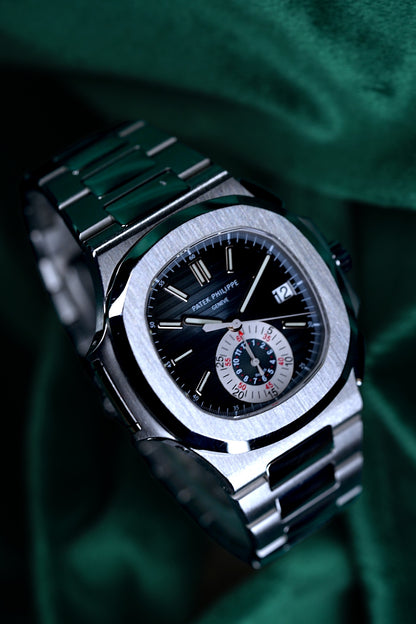 Patek Philppe Nautilus | Ref 5980/1a-001 | A Blue Dial Stainless Steel Flyback Chronograph Wristwatch