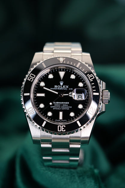 Rolex Submariner Date a Stainless Steel timepiece A stainless steel wristwatch with date and bracelet in Full Seet | 40mm OysterSteel