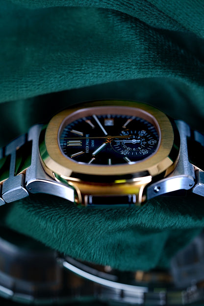 Patek Philippe Nautilus Chronograph Ref. 5980/1ar-001 | A Rare and Highly Attractive Stainless Steel and 18k Pink Gold Automatic Flyback Chronograph Wristwatch in Complete Set