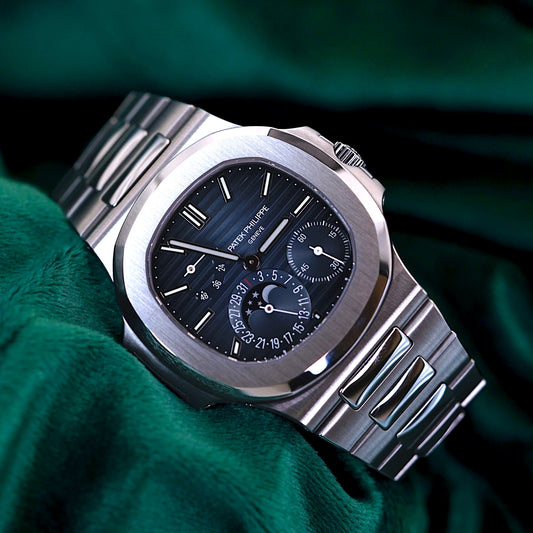 Patek Philippe Nautilus Stainless Steel 5712/1A-001 Discontinued a RARE Moonphase & Date Blue Dial watch in Full Set