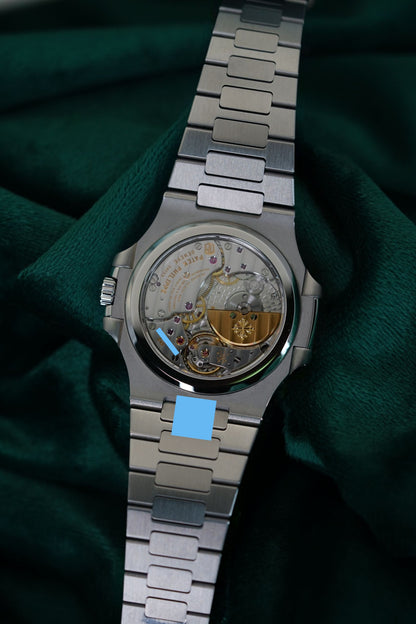 Patek Philippe Nautilus Stainless Steel 5712/1A-001 Discontinued a RARE Moonphase & Date Blue Dial watch in Full Set
